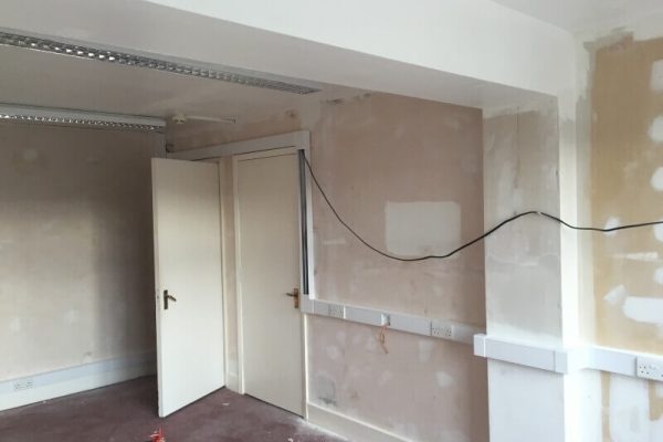 room stripped of paint and wallpaper ready to be decorated